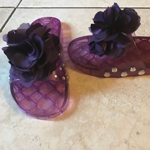 Purple slides made with a bow and studs